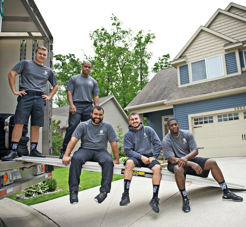 movers sitting on a truck ramp