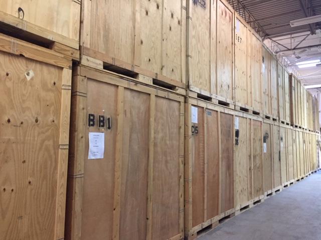 Portable storage crates in a climate regulated warehouse